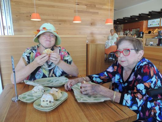 Mother and Doughter eating Pies